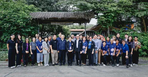 Bangkok University, together with Thai Beverage Public Company Limited (ThaiBev) and the Ban Khlong Sam OTOP Nawatwithi Sufficiency Economy Community in Khlong Luang District, Pathum Thani Province, has continued an academic service project for two consecutive years — one where the community owns the problem and co-designs its own development. The project brings knowledge from multiple disciplines directly into the field to solve real issues, ranging from designing tourism routes, local food sets, landscaping and interpretive signage, to developing a "Smart Banana Drying House," which became a new product generating income for the community. The project is now being prepared as a model for academic service that can be expanded to other communities. Bangkok University executives and faculty members from the participating schools visited the site to review project outcomes at the Ban Khlong Sam OTOP Nawatwithi Sufficiency Economy Community, joined by representatives from ThaiBev and the EISA project, as well as community leaders and representatives, to discuss the direction for future collaboration.